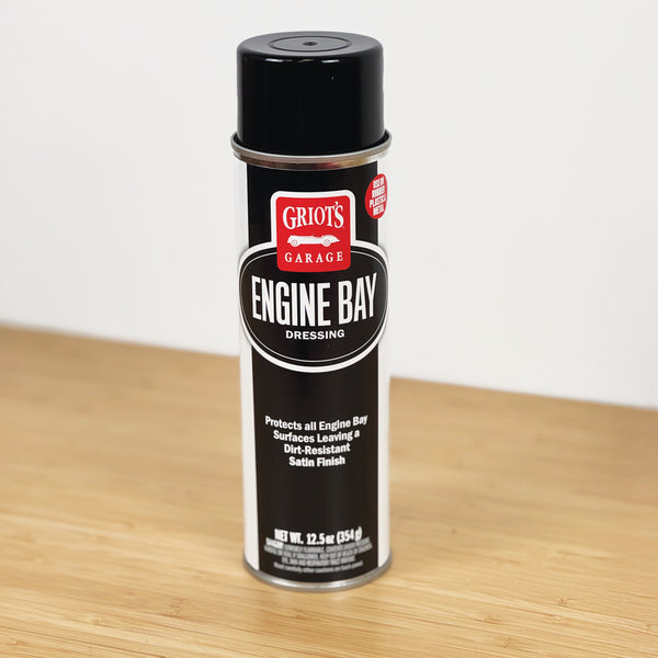 Can of Griot's Garage Engine Bay Dressing on a wooden surface with a white background