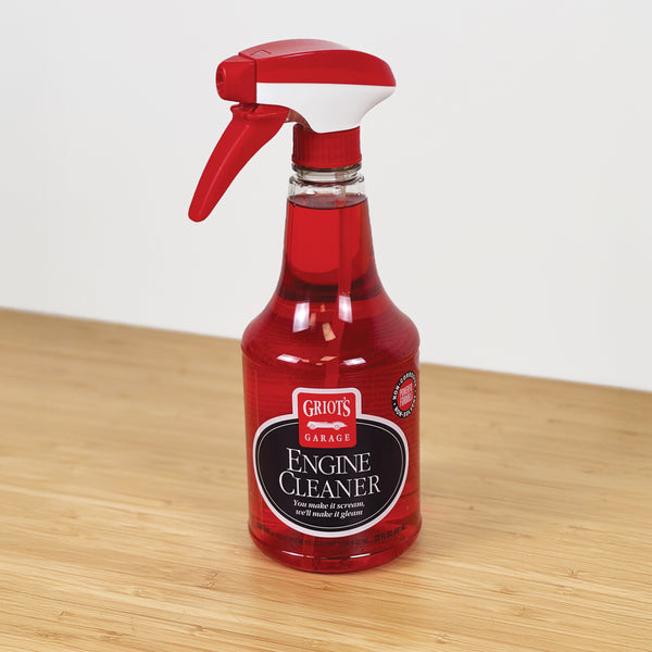 Bottle of Griot's Garage Engine Cleaner on a wooden surface with a white background