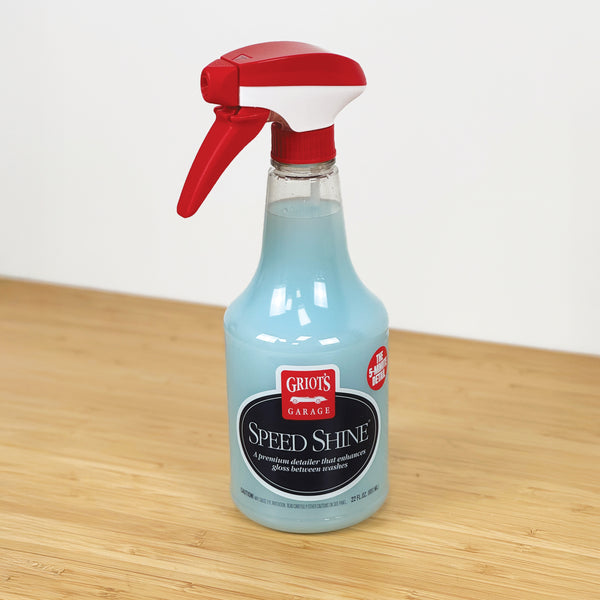 Bottle of Griot's Garage Speed Shine on a wooden surface with a white background