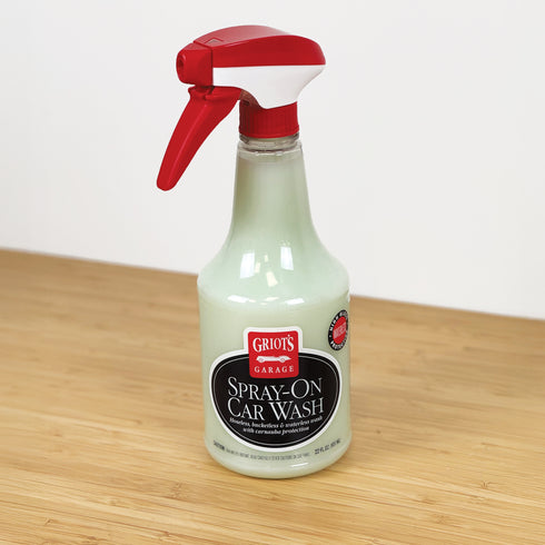 Bottle of Griot's Garage Spray-On Car Wash on a wooden surface with a white background